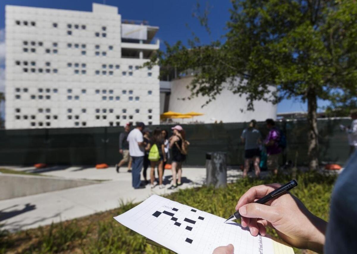 Carlos Carrillo, 47, from Miami Lakes, jots down some notes during the 2018 Herald Hunt at Museum Park in downtown Miami on Sunday, March 4, 2018.