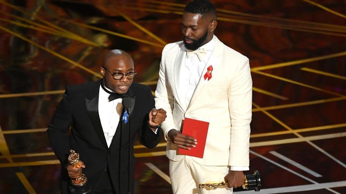 Writer/director Barry Jenkins and writer Tarell Alvin McCraney accept Best Adapted Screenplay for 'Moonlight' onstage during the 89th Annual Academy Awards at Hollywood & Highland Center on February 26, 2017 in Hollywood, California.