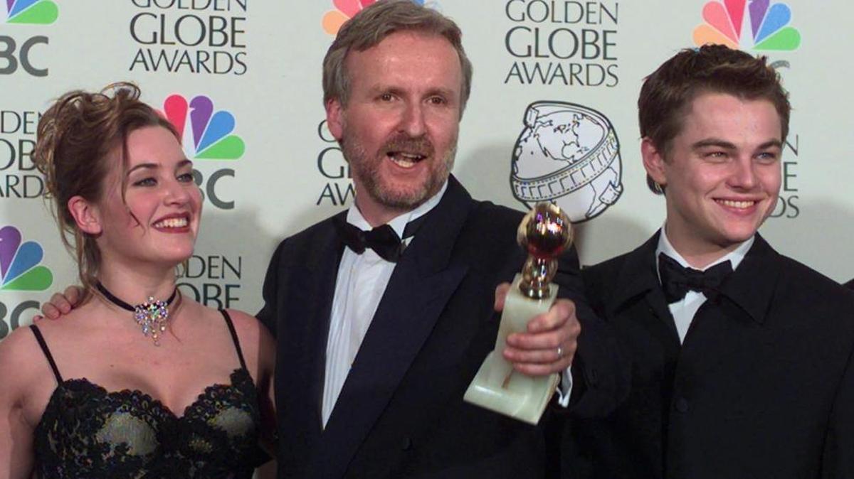 In this Jan. 18, 1998, file photo, Director James Cameron, center, poses with Kate Winslet and Leonardo DiCaprio after winning the awards for Best Dramatic Motion Picture and Best Director for the film "Titanic" at the 55th Annual Golden Globe Awards in Beverly Hills, Calif. Twenty years after DiCaprio and Winslet fell in love on that doomed ship, â€œTitanicâ€ is sailing back into theaters for one week. Dolby Laboratories, Paramount Pictures and AMC Theaters said Wednesday, Nov. 15, 2017, that the Cameron film will be shown in re-mastered Dolby Vision at select AMC locations nationwide starting Dec. 1.
