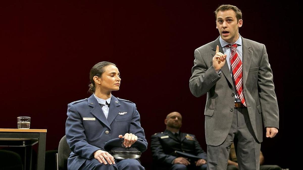 Actor Peter Roman (right) defends Mia Maestro, who plays the pilot at the center of “Terror.” Miami New Drama is staging the U.S. premiere of this interactive play at the Colony Theater on South Beach, opening Thursday.