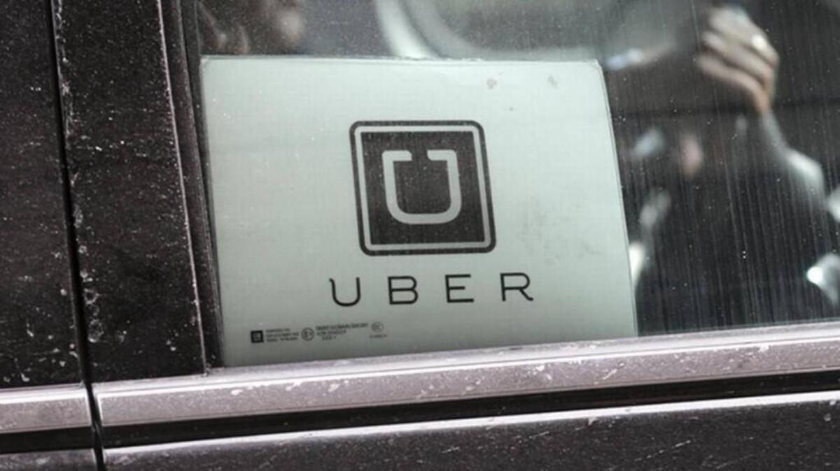 An Uber car drives through LaGuardia Airport in New York.