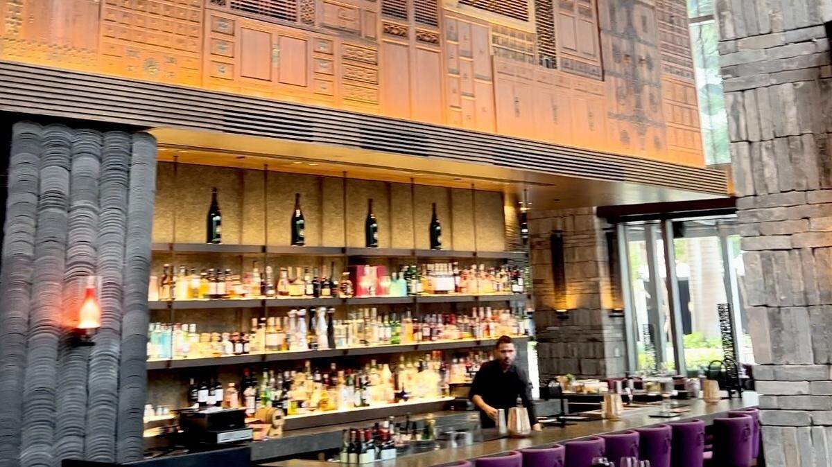 Hutong is decorated with a 70-foot-long wall of hand-carved Chinese wood paneling and doors.