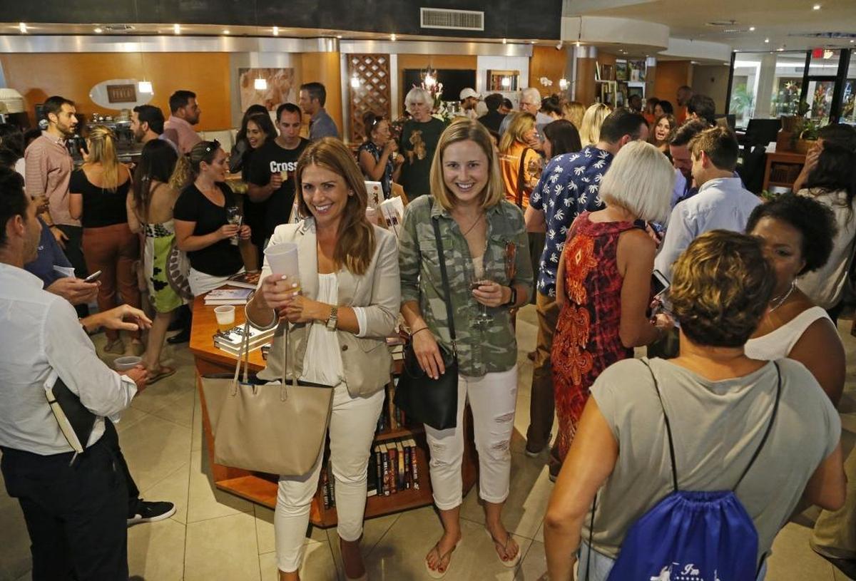 Guests packed The Bookstore in the Grove on Friday for an open house party.