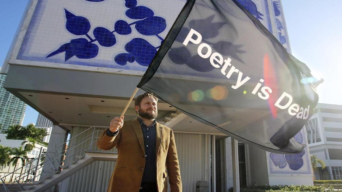 P. Scott Cunningham, the founder of O, Miami playfully flies his "Poetry Is Dead" flag a few years back.