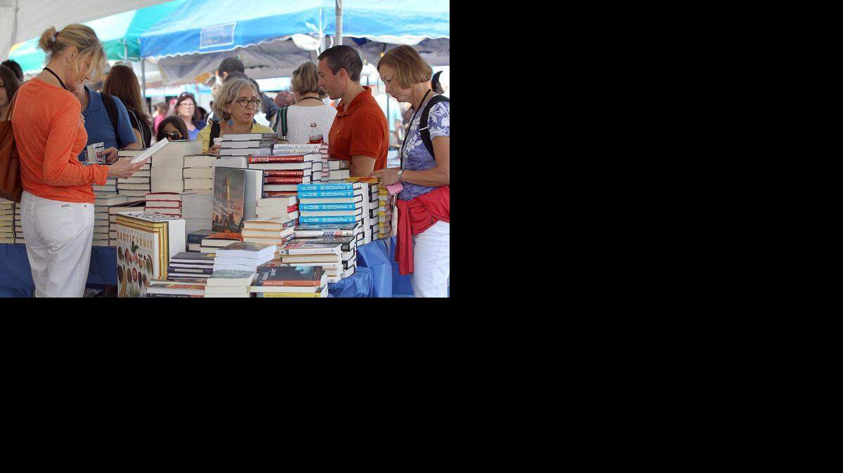 
Book lovers enjoyed a beautiful day looking through hundreds of books at the Books and Books booth, during the 2012 Miami International Book Fair, taking place at MDC Wolfson Campus in downtown Miami on Saturday, November 17, 2012.
