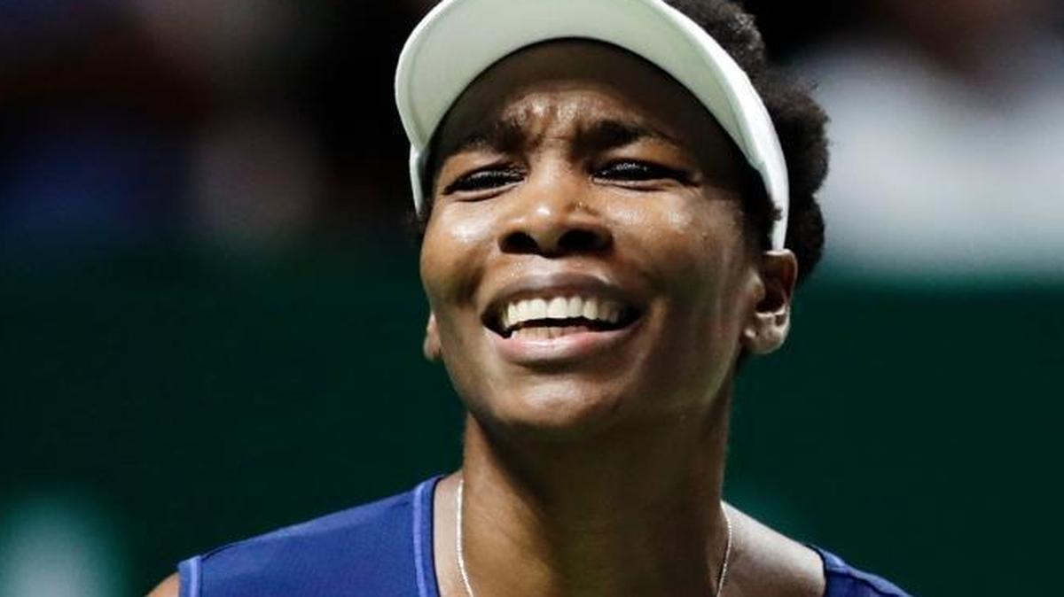 Venus Williams reacts on Oct. 28, 2017, after conceding a point to Caroline Garcia, of France, during their semifinal match at the WTA tennis tournament in Singapore. Burglars hit the tennis star's Florida home, stealing $400,000 worth of goods while she was at the U.S. Open. The burglary happened between Sept. 1 and 5.
