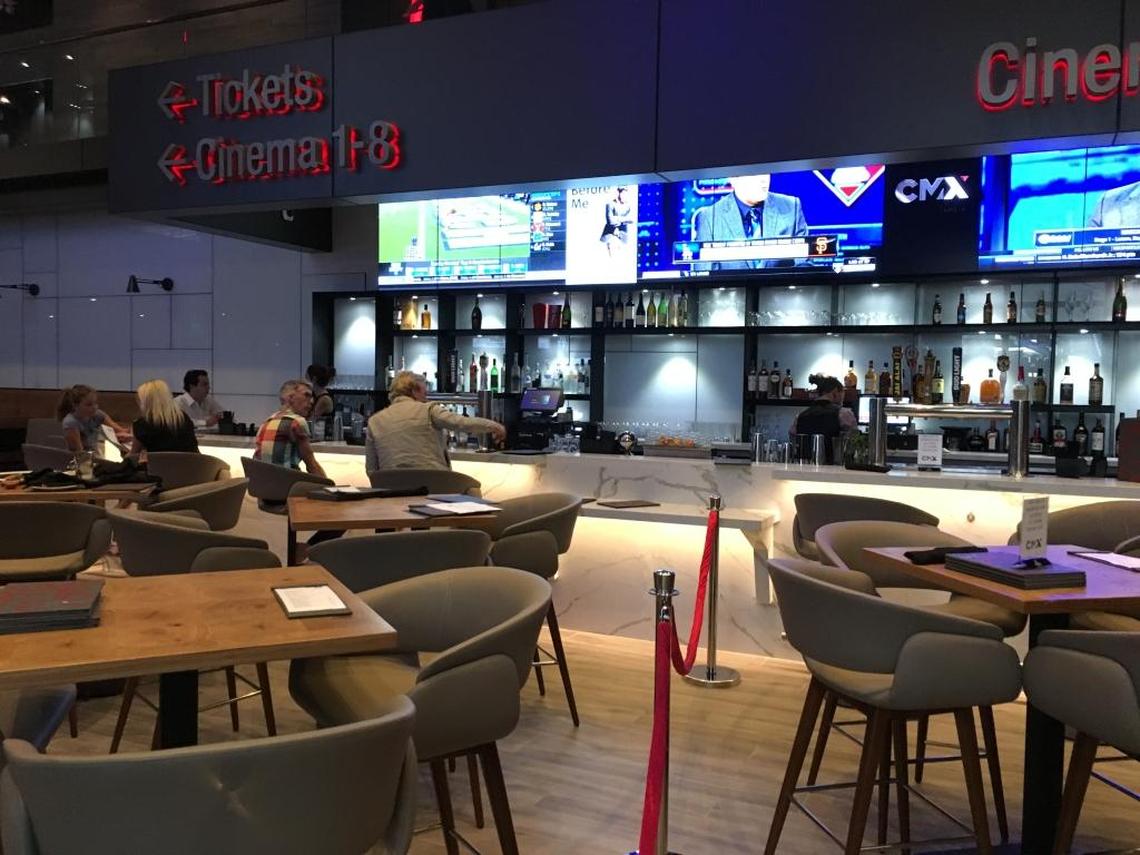 The bar features signature cocktails and happy hour specials on weekdays.