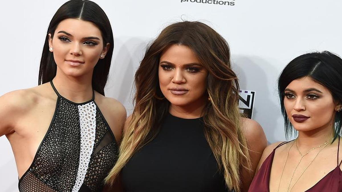 
FILE - In this Sunday, Nov. 23, 2014, file photo, Kendall Jenner, from left, Khloe Kardashian and Kylie Jenner arrive at the 42nd annual American Music Awards at Nokia Theatre L.A. Live in Los Angeles. The Kardashian and Jenner families have such a heavy media, social and Internet presence, that some are wondering if there are signs of Kardashian Fatigue developing. (Photo by Jordan Strauss/Invision/AP, File).
