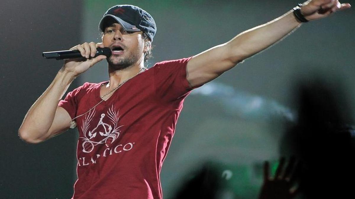FILE - This Aug. 11, 2012 file photo shows Enrique Iglesias performing at the Honda Center in Anaheim, Calif., during his tour with Jennifer Lopez. The Top 20 Concert Tours ranks artists by average box office gross per city and includes the average ticket price for shows in North America. Iglesias and Lopez were ranked seventh.