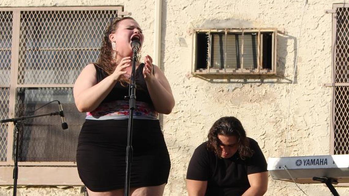 Singer Yoli Mayor, far left, performs Sunday Jan. 10 at the Arts + Entertainment District’s monthly market, Miami Flea. Federico Colloca is on keyboard and Albert Bade plays the cajon, a Peruvian percussion instrument.