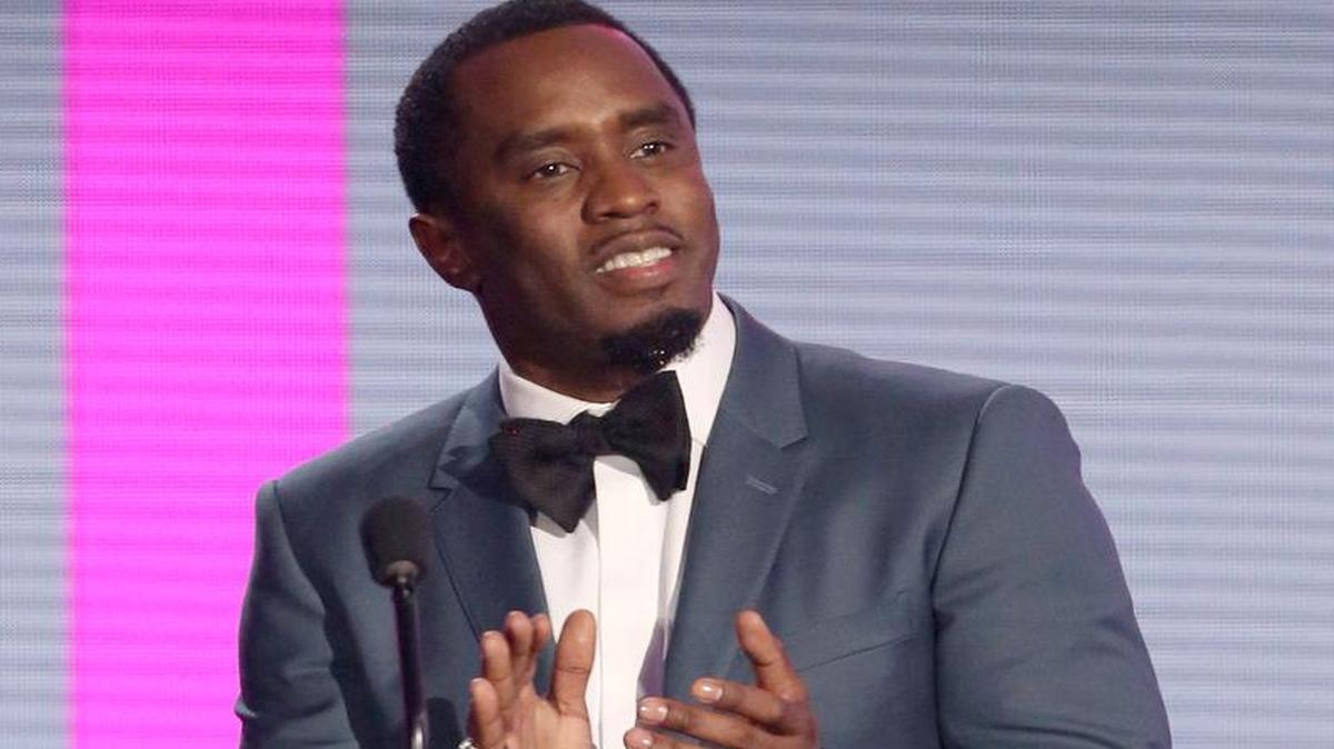 In this Nov. 22, 2015 file photo, Sean Combs presents an award at the American Music Awards in Los Angeles. The veteran music mogul expects to perform on "Pitbull's New Year's Resolution" concert on Fox and will rerelease his recent critically-acclaimed mixtape "Money Making Mitch" through iTunes on Friday. It's the prequel to Puff Daddy's final album "No Way Out 2," which will release next year.