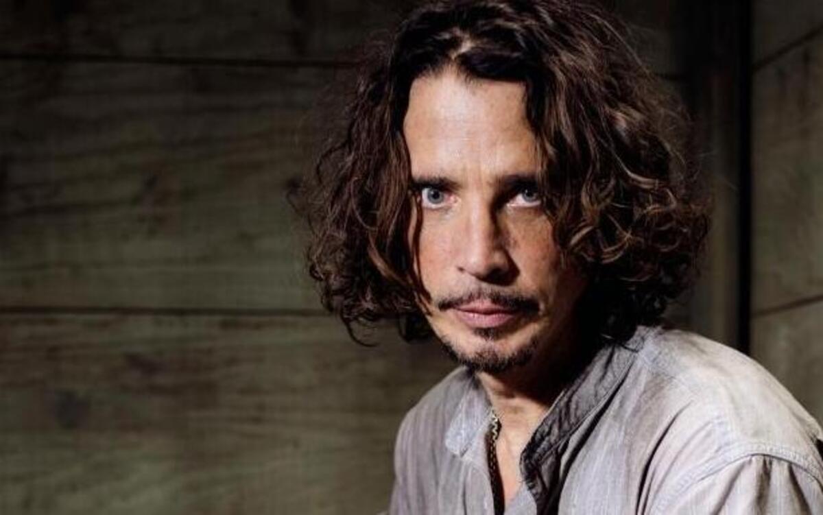 FILE - In this July 29, 2015 file photo, Chris Cornell plays guitar during a portrait session at The Paramount Ranch in Agoura Hills, Calif. Cornell, 52, who gained fame as the lead singer of the bands Soundgarden and Audioslave, died at a hotel in Detroit and police said Thursday, May 18, 2017, that his death is being investigated as a possible suicide.