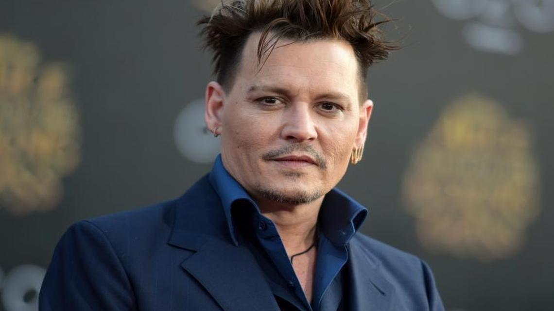 Johnny Depp arrives at the premiere of “Alice Through the Looking Glass.” The actor is set to be part of “Fantastic Beasts and Where to Find Them.”