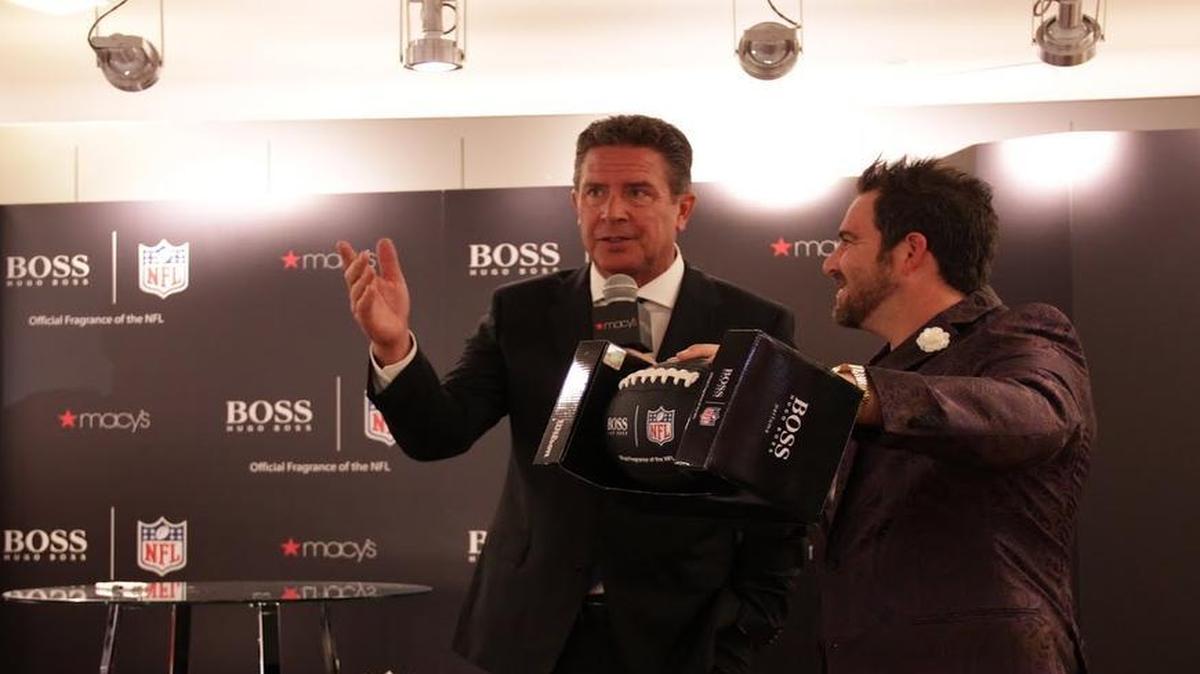 Dan Marino appears at a Macy’s Dadeland fan event for Hugo Boss Fragrances with host Evan Golden
