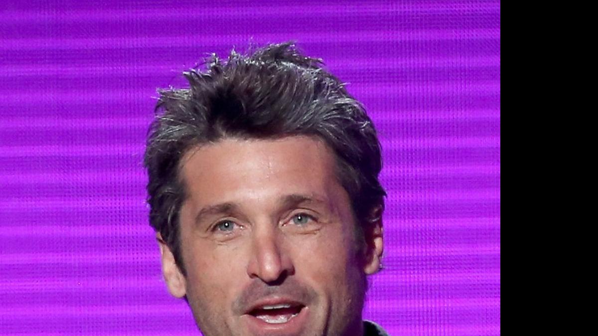 FILE- In this Nov. 23, 2014 file photo, Patrick Dempsey presents the award for pop/rock band, duo or group on stage at the 42nd annual American Music Awards in Los Angeles. In the Thursday, April 23, 2015, episode of "Grey's Anatomy" Dempsey made a surprise departure from the series, when his character Derek "McDreamy" Shepherd died from injuries suffered when he was blindsided by a truck. (Photo by Matt Sayles/Invision/AP, File)