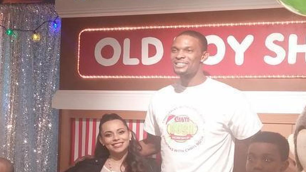 Adrienne Bosh and Chris Bosh attend their Team Tomorrow Inc annual Xmas event at GameTime Dec 19 2015