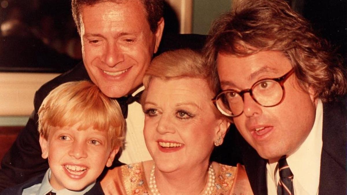 
Little Roshi Handwerger (now WSVN reporter Rosh Lowe) with composer Jerry Herman, Angela Lansbury and ‘La Cage aux Folles’ producer Allan Carr at the opening night party for the 1983 Broadway revival of ‘Mame.’
