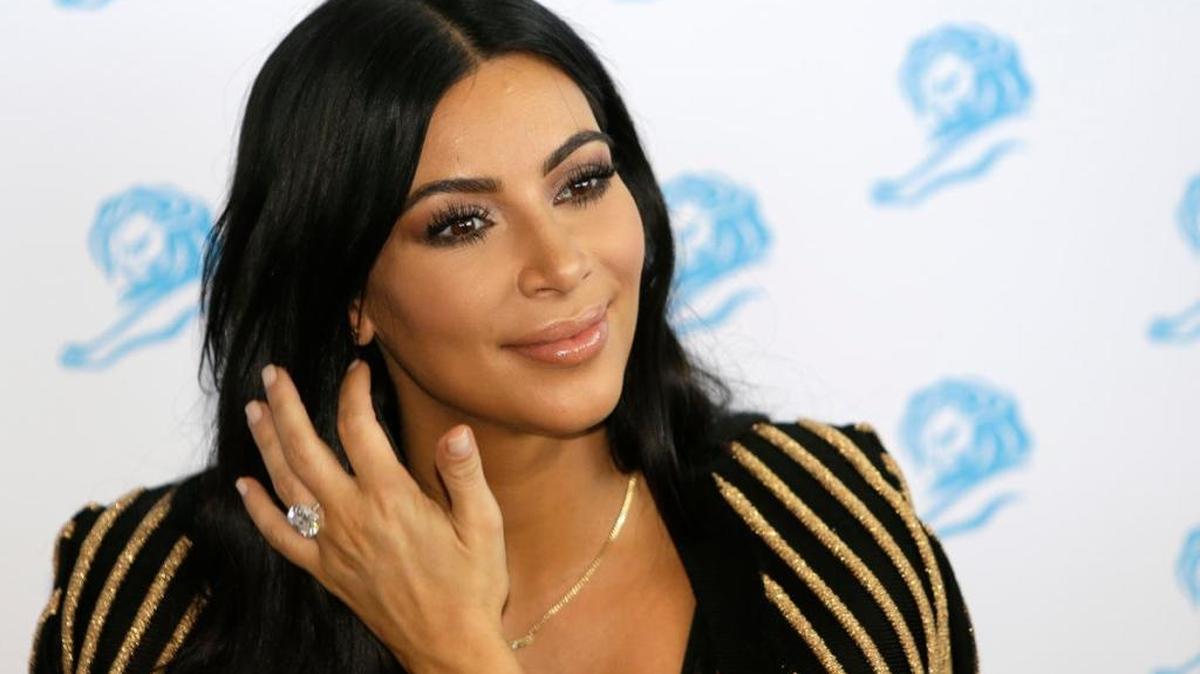 FILE - In this June 24, 2015 file photo, American television personality Kim Kardashian poses for photographers as she attends the Cannes Lions 2015 in Cannes, southern France. The reality TV star is scheduled to speak and sign copies of her new coffee table book “Selfish” during a Tuesday, June 30 night event hosted by the Commonwealth Club of California, which bills itself as the nation's oldest and largest public affairs forum.
