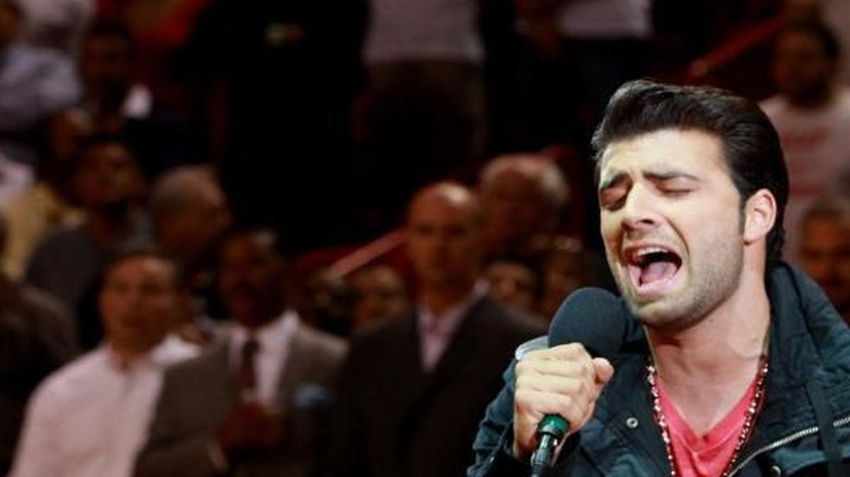 Jencarlos Canela sings the national anthem before a Heat game in 2012. Last week he performed at the Billboard Latin Music Awards.