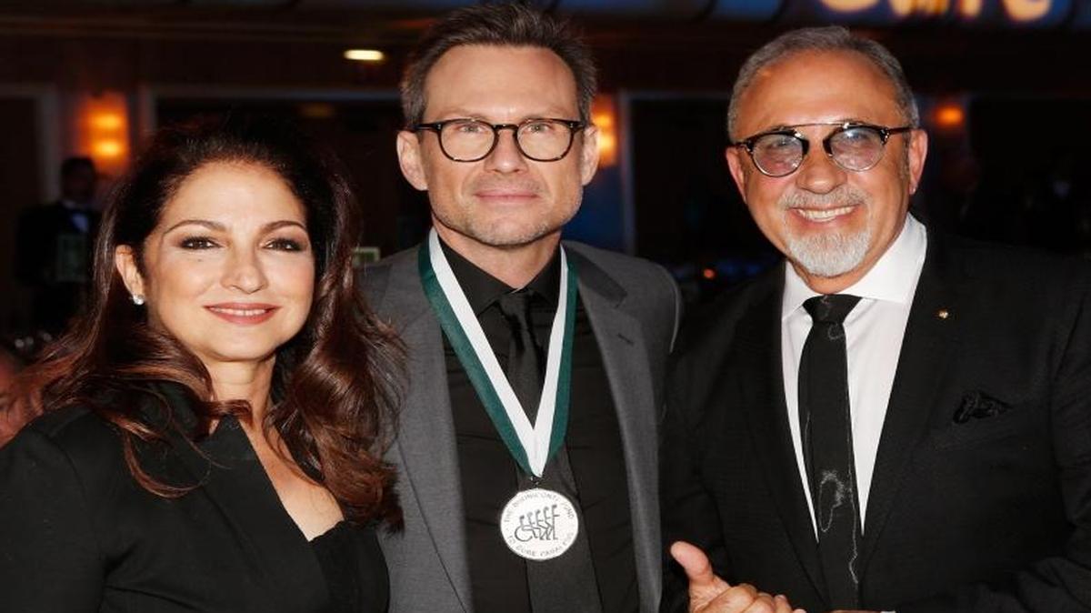 Gloria Estefan, Christian Slater and Emilio Estefan attend the 31th Annual Great Sports Legends Dinner to benefit The Buoniconti Fund to Cure Paralysis at The Waldorf Astoria Hotel Sept. 12, 2016 in NYC.
