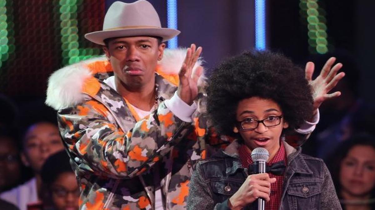 : Nick Cannon and Honoree Joshua Williams speak on stage at the 2015 Nickelodeon HALO Awards at Pier 36 on November 14, 2015 in New York City.