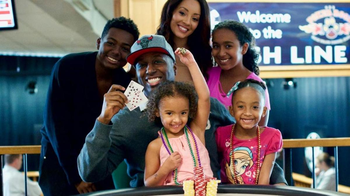 Maurice Hawkins and his family celebrate after a February tournament win at the Palm Beach Kennel Club.
