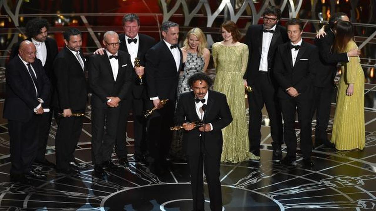 
Alejandro G. Inarritu, center, and the cast and crew of “Birdman or (The Unexpected Virtue of Ignorance)” accept the award for the best picture at the Oscars on Sunday, Feb. 22, 2015, at the Dolby Theatre in Los Angeles. 
