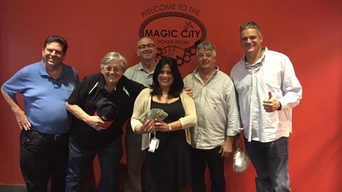 Quad squad winners celebrate with Magic City cardroom manager Ileana Zamora: Roger Warren Collette, left, Pedro P. Martinez, Oscar Salinas, Jose Manuel Pena and Stelvio Giachello.