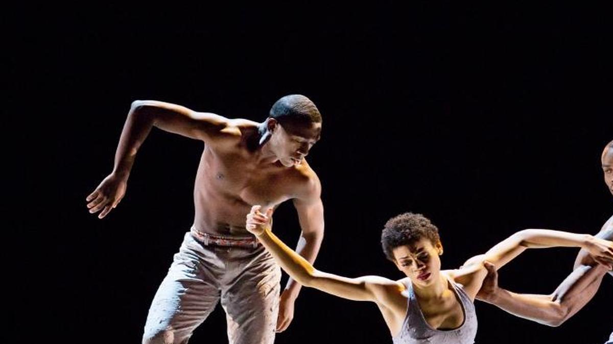 Alvin Ailey American Dance Theater’s Chalvar Monteiro, Ghrai DeVore, and Jamar Roberts in Kyle Abraham’s “Untitled America.”