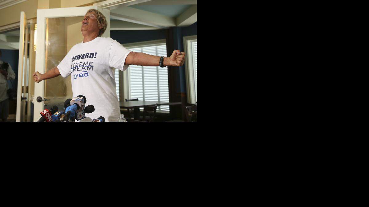 
LONG DISTANCE WINNER: Endurance swimmer Diana Nyad talks to the media, during a press conference in Key West in 2013. She said the biggest challenge was swallowing large amounts of seawater, which made her vomit often. The 64-year-old is the first swimmer to make the 110-mile journey without a shark cage. 


