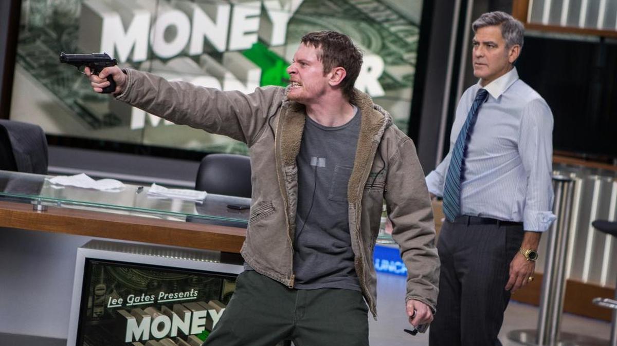 A gunman (Jack O'Connell) takes a TV news reporter (George Clooney) hostage during a live broadcast in ‘Money Monster.’