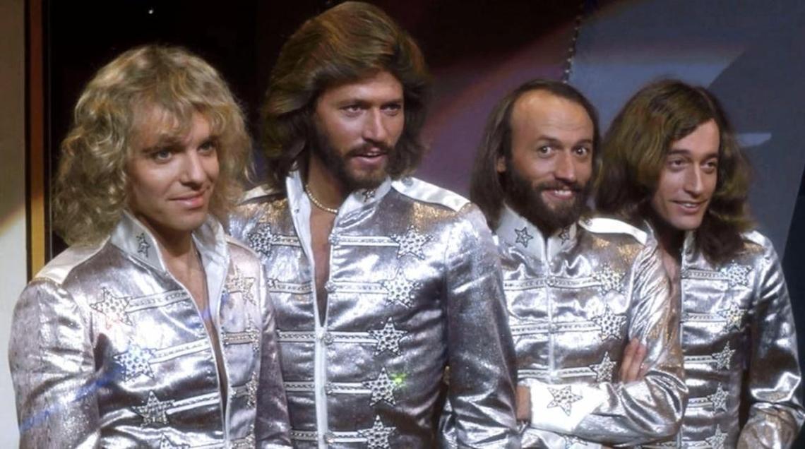 Maurice Gibb (second from right) winks in a scene from “Sgt. Pepper’s Lonely Hearts Club Band.” Even Mo knew this was a silly lark. Just go with it.