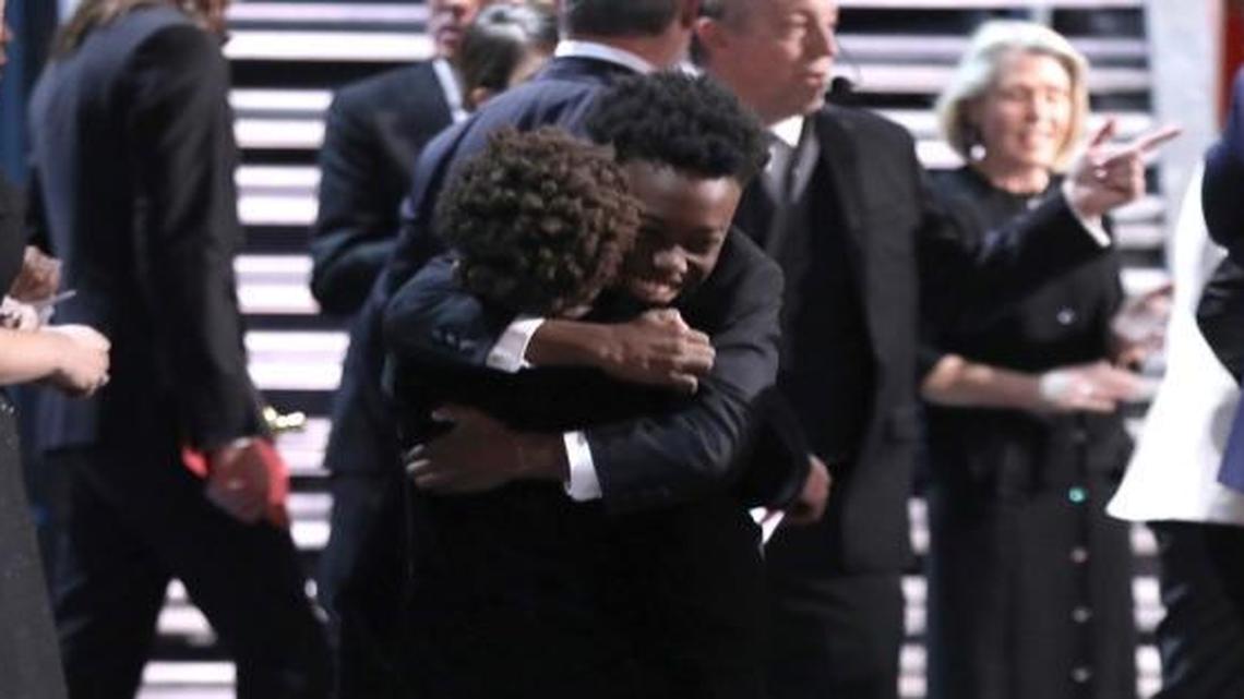 Jaden Piner and Alex R Hibbert embrace as "Moonlight" wins the best picture award at the Oscars on Sunday, Feb. 26, 2017, at the Dolby Theatre in Los Angeles.