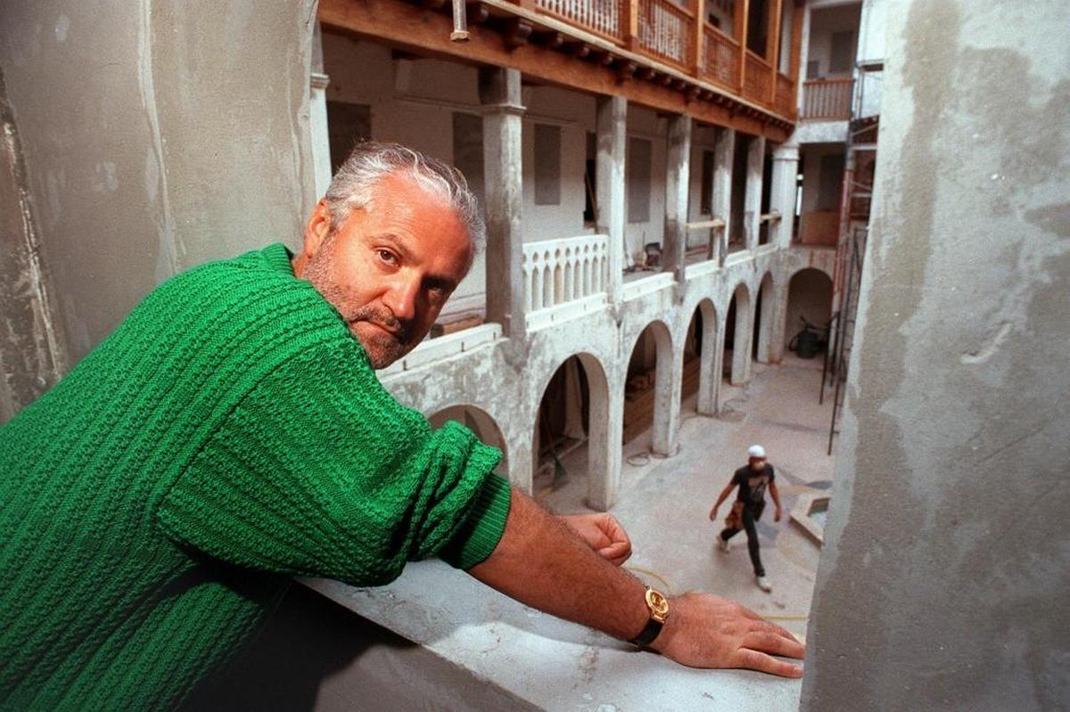 In this file photo dated March 16, 1993, Italian fashion designer Gianni Versace looks out from a second-story window overlooking his patio, during the renovation works of his mansion on Ocean Drive in South Beach.