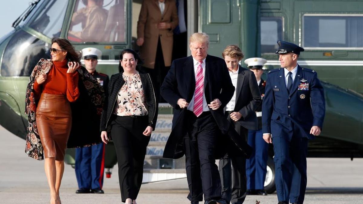 First lady Melania Trump, left, walks with President Donald Trump, and son Barron Trump, 11, as they board Air Force One on Tuesday, Nov. 21, 2017, at Andrews Air Force Base, Maryland. The first family was en route to Mar-a-Largo in Palm Beach to celebrate Thanksgiving.