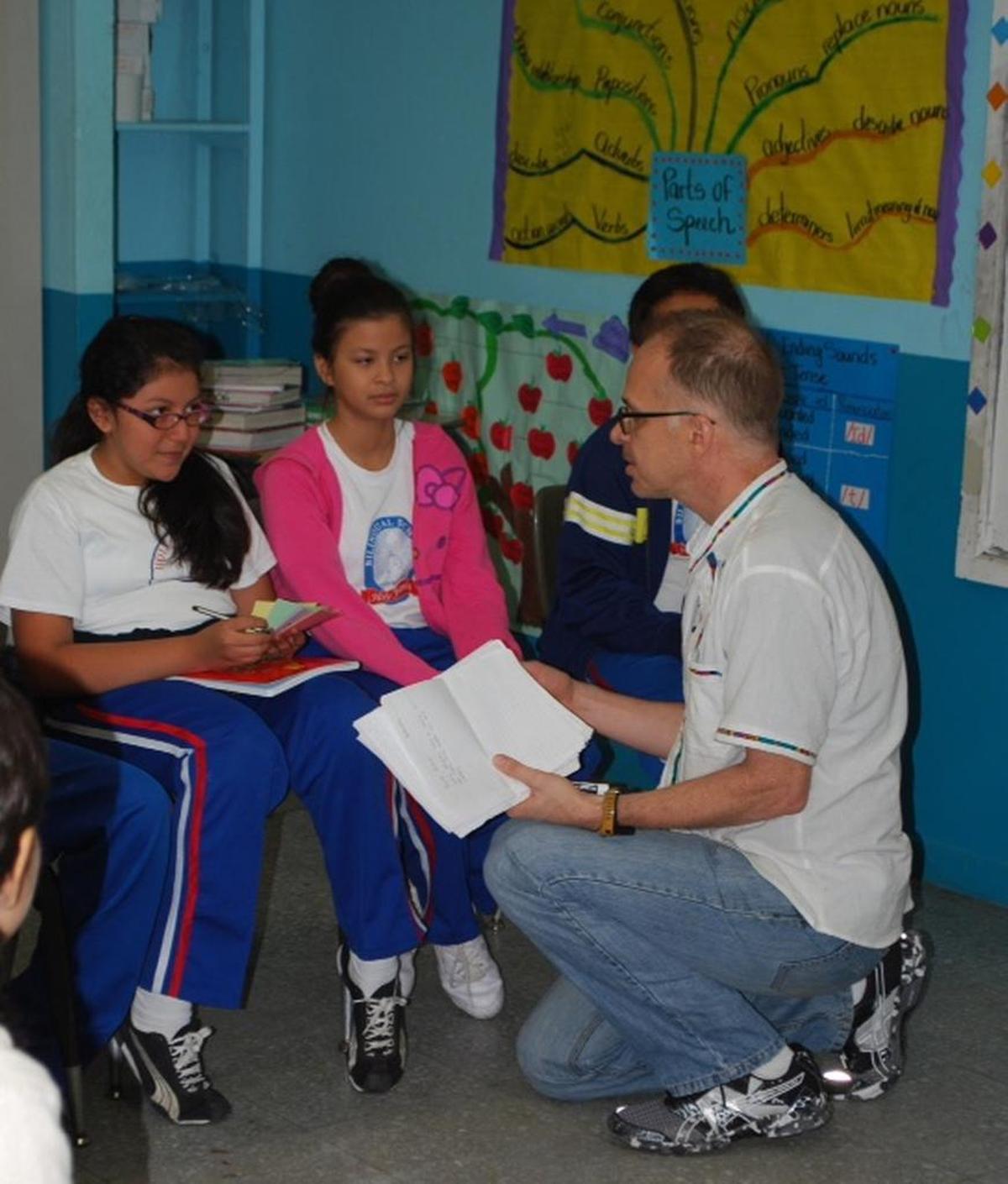Spencer Reece teaching poetry to the girls at Holy Family Bilingual School, part of Our Little Roses, a home in Honduras for abused and abandoned girls. The poetry project has been made into a documentary, “Voices Beyond the Wall: Twelve Love Poems From The Murder Capital of the World,” which will premiere at the Miami Film Festival on Sunday, March 5, 2017.