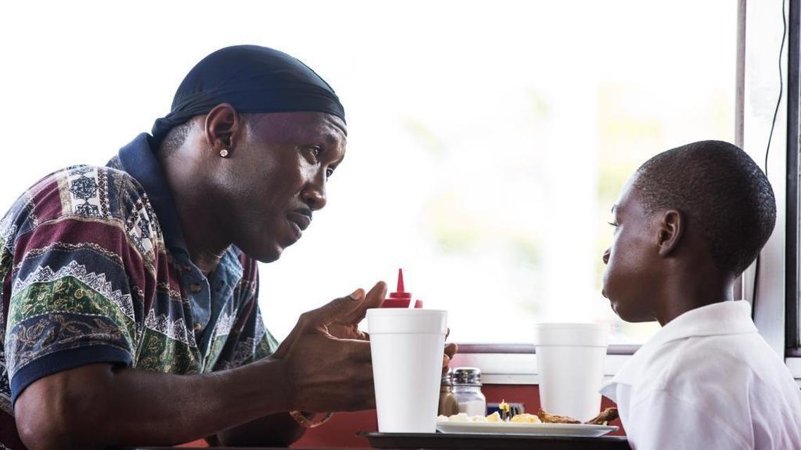The drug-dealing Juan (Mahershala Ali) takes a fatherly interest in the young Chiron (Alex Hibbert) in the made-in-Miami drama ‘Moonlight.’