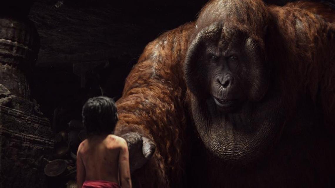Mowgli (Neel Sethi) meets King Louie (voiced by Christopher Walken) in ‘The Jungle Book.’