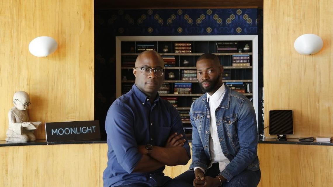Filmmaker Barry Jenkins (left) and actor/playwright Tarell Alvin McCraney (right) inside the lobby of the Standard Hotel in Miami Beach. The two men grew up within blocks of each other in Liberty City, but they never met until they collaborated on the drama ‘Moonlight,’ which was inspired by their personal experiences.
