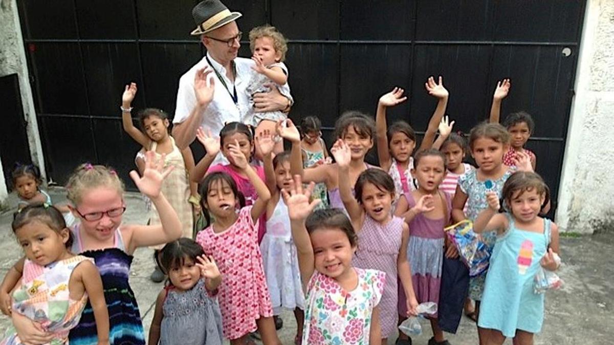 Spencer Reece with some of the girls at Our Little Roses, the home and bilingual school for abused and abandoned girls in San Pedro Sula, Honduras, started by Miami’s Diana Frade in the late 1980s.