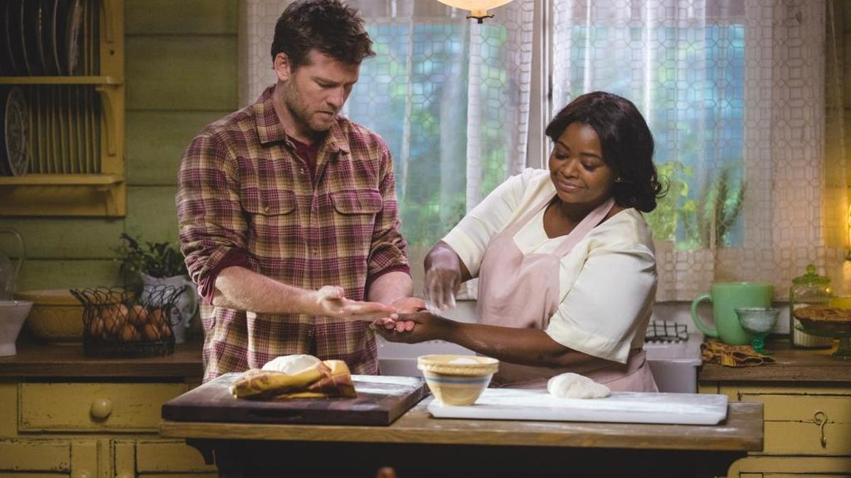 Mack (Sam Worthington) and Papa (Octavia Spencer) prepare a meal in a scene from ‘The Shack.’