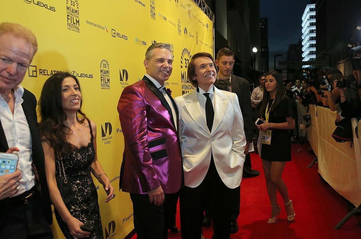 Festival director Jaie Laplante, left, poses with music icon Raphael, of Spain, during the opening the 2016 Miami Film Festival at the Olympia Theater.