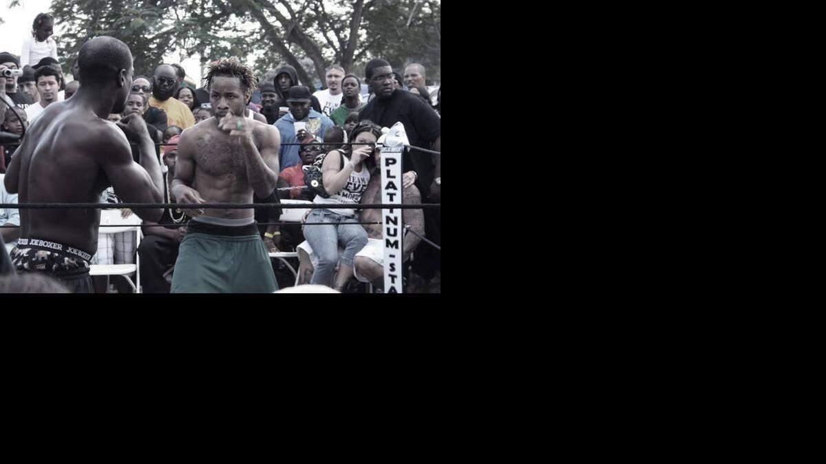 
Treon Johnson (center) squares off against an opponent in ‘Dawg Fight.’

