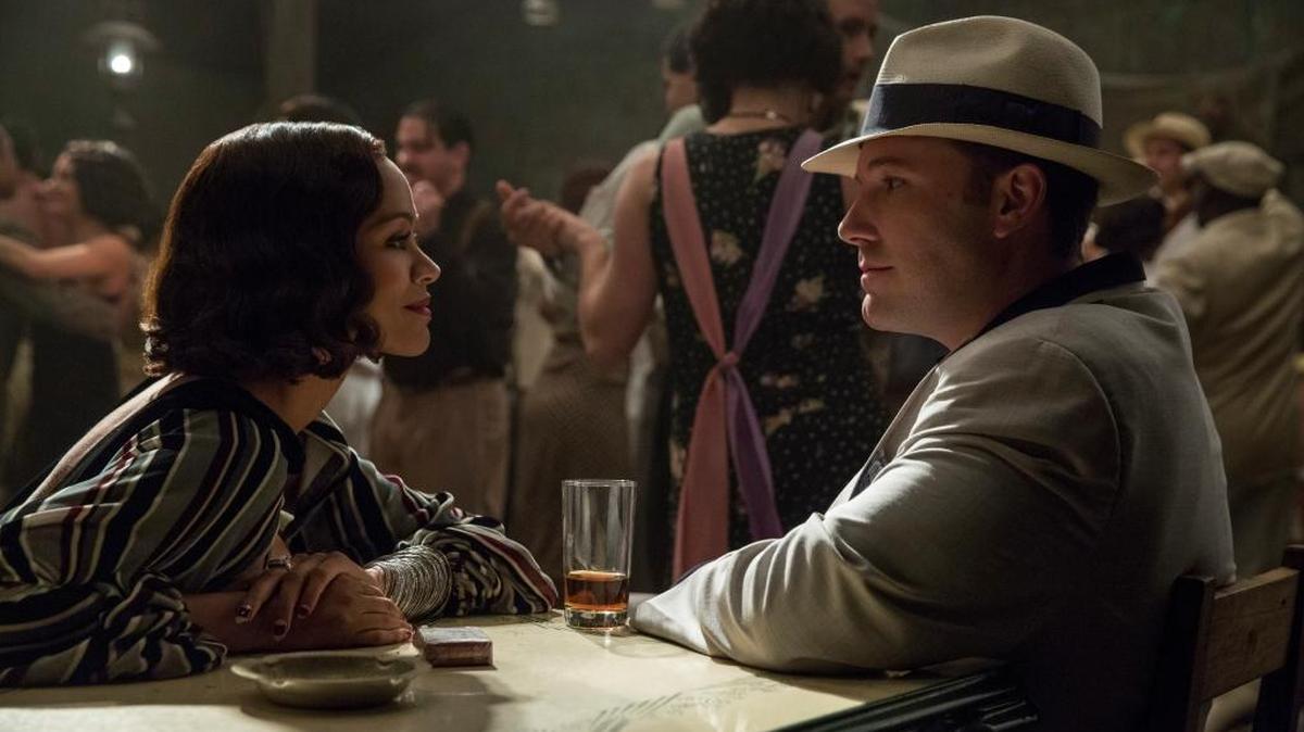 Zoe Saldana and Ben Affleck share a quiet moment in ‘Live By Night.’