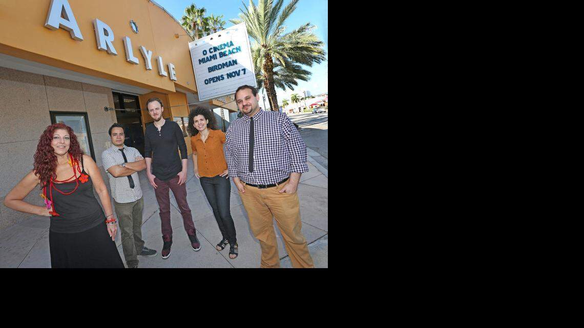 
Vivian Marthell and Kareem Tabsch, co-directors of O Cinema, in front of their new Beach theater with staff members.

