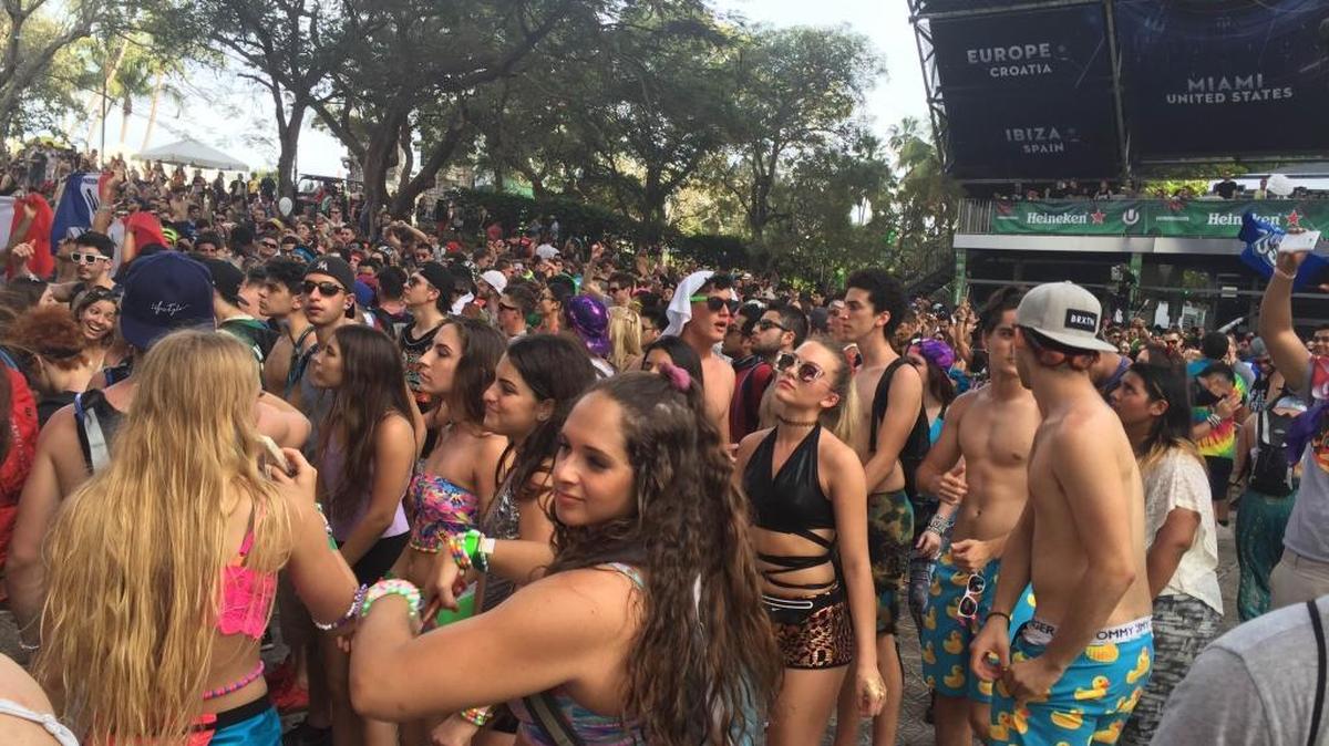Electronic music fans dance to the pulsing beats of Ultra Music Festival in downtown Miami on Saturday, March 19, 2016.