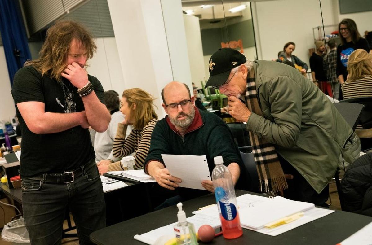 From left, Christopher Jahnke, music supervisor, Christopher Ashley, director, and Jimmy Buffet confer during a rehearsal for “Escape to Margaritaville,” in New York, Feb. 2, 2018.