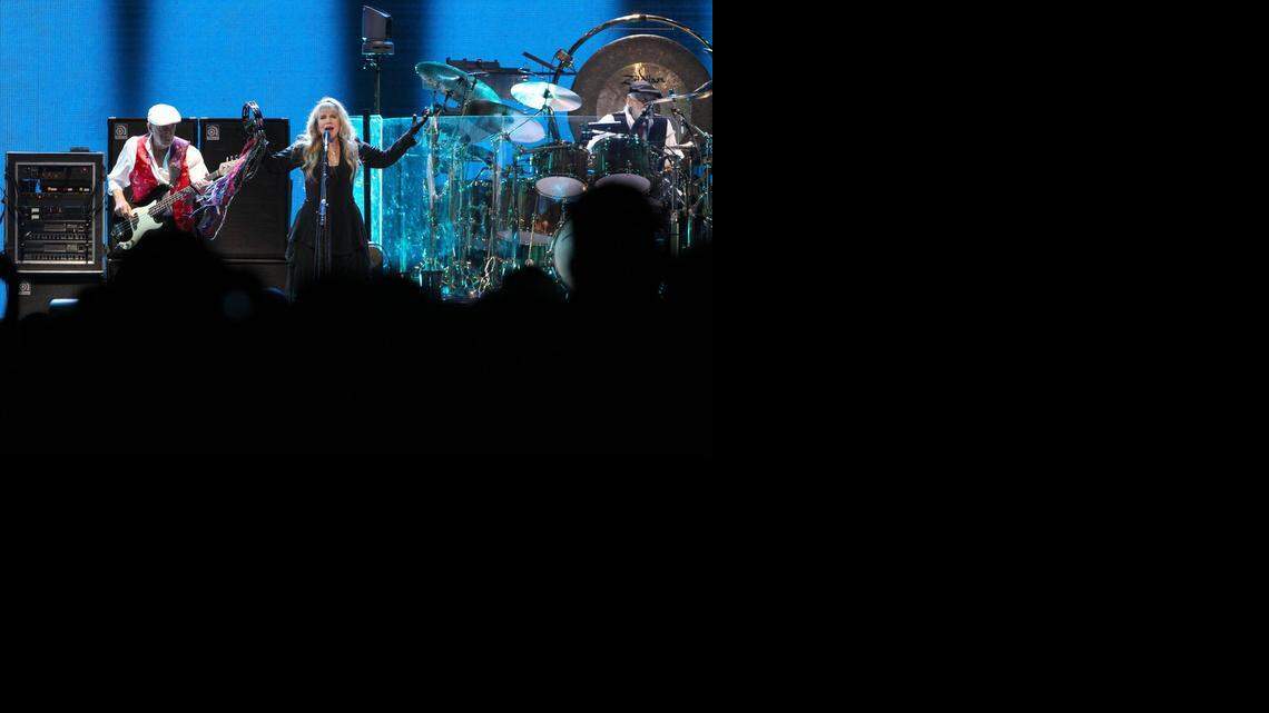 
ROCKING ‘RUMOURS’: Fleetwood Mac opens its reunion concert with ‘The Chain’ before a sold-out crowd at Sunrise's BB&T Center. Singer Stevie Nicks, center stage, bassist John McVie, (left) and drummer Mick Fleetwood, (right) were joined by guitarist Lindsey Buckingham and keyboardist Christine McVie, whose return after a 16-year absence allowed the band to reintroduce her hits like ‘You Make Loving Fun,’ ‘Over My Head’ and ‘Little Lies.’
