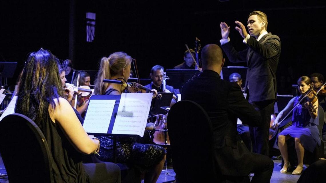 Jacomo Bairos, co-artistic director and founder of Nu Deco Ensemble, conducts the 24-member chamber symphony.