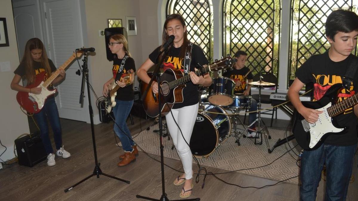 Ripcord, a Miami Beach youth band, practices in hopes of performing in March as opening act to Grammy-nominated band Locos Por Juana. From left: Ivy Rosenberg, Sierra Kaufmann, Lily Kaplan, Harrison Maltick and Jake Alemán.
